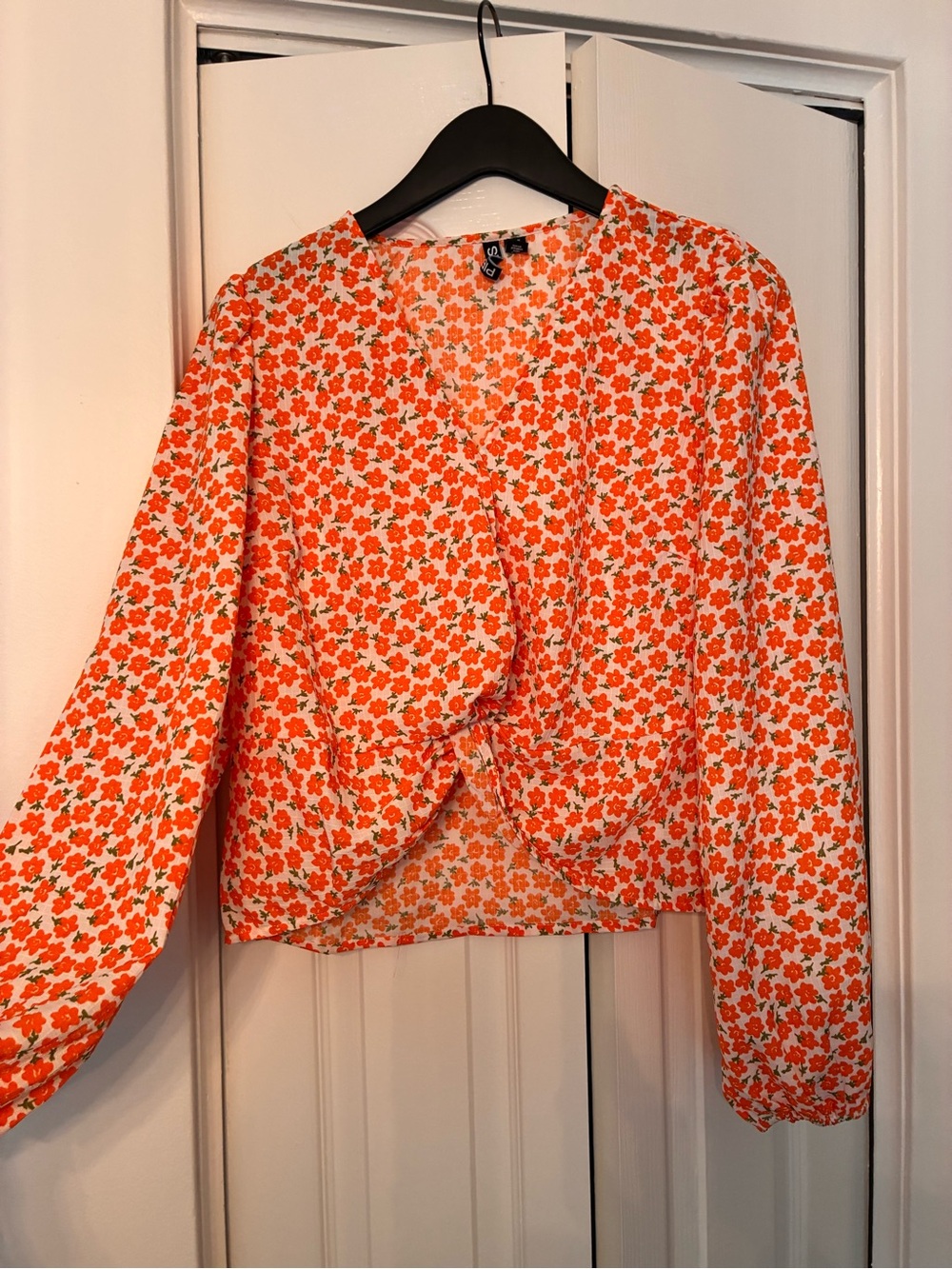 Faux wrap top with bell sleeves